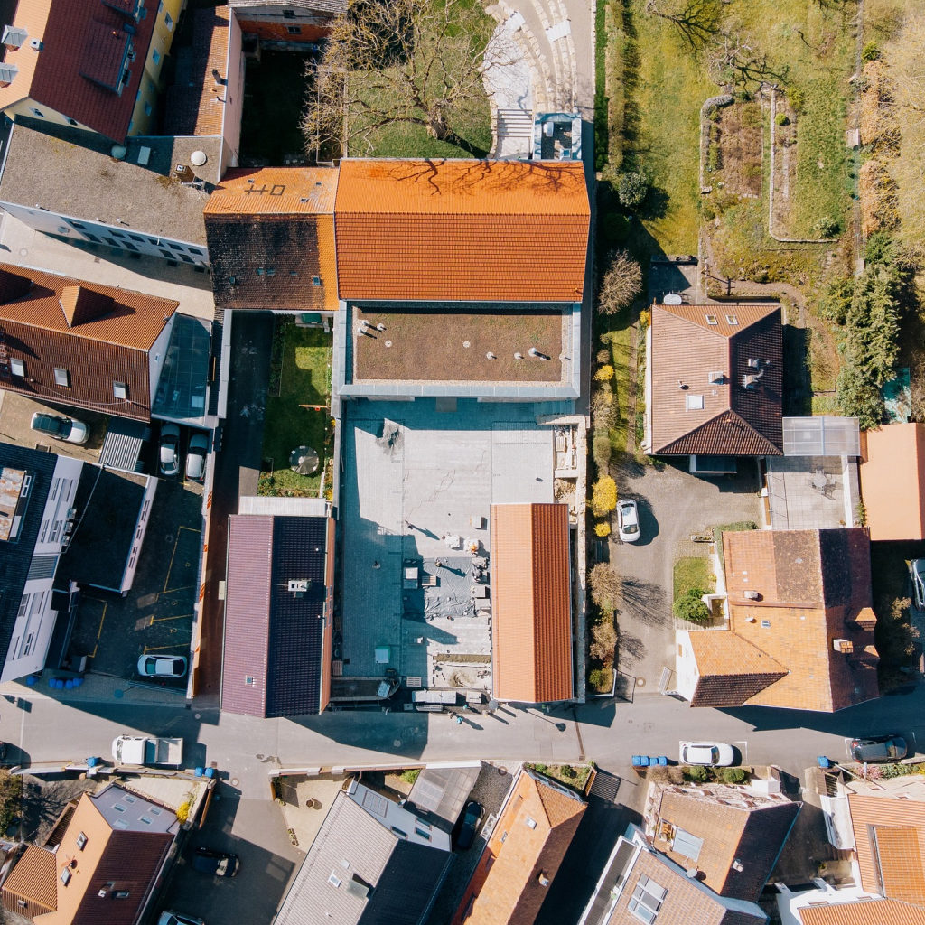 A top view footage of a building captured by a drone flying above